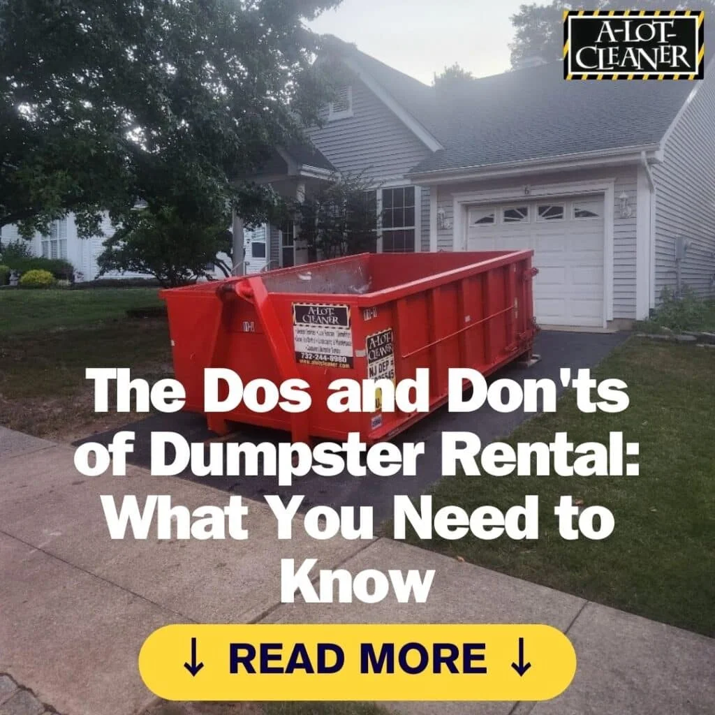 A red dumpster parked on a residential driveway in front of a white suburban home.
